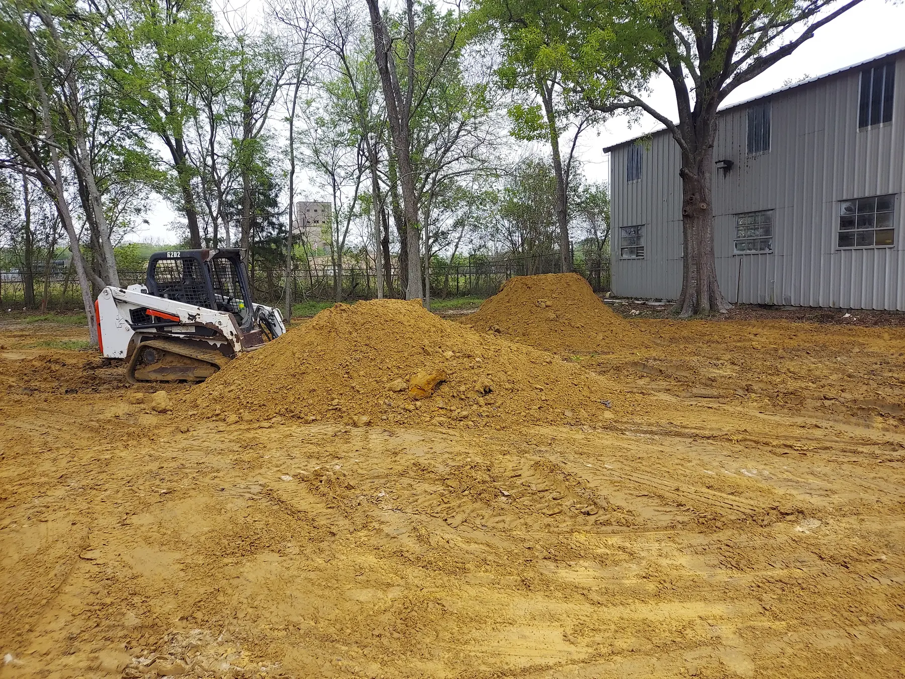 409 Demo excavator rough grading a Southeast Texas work area