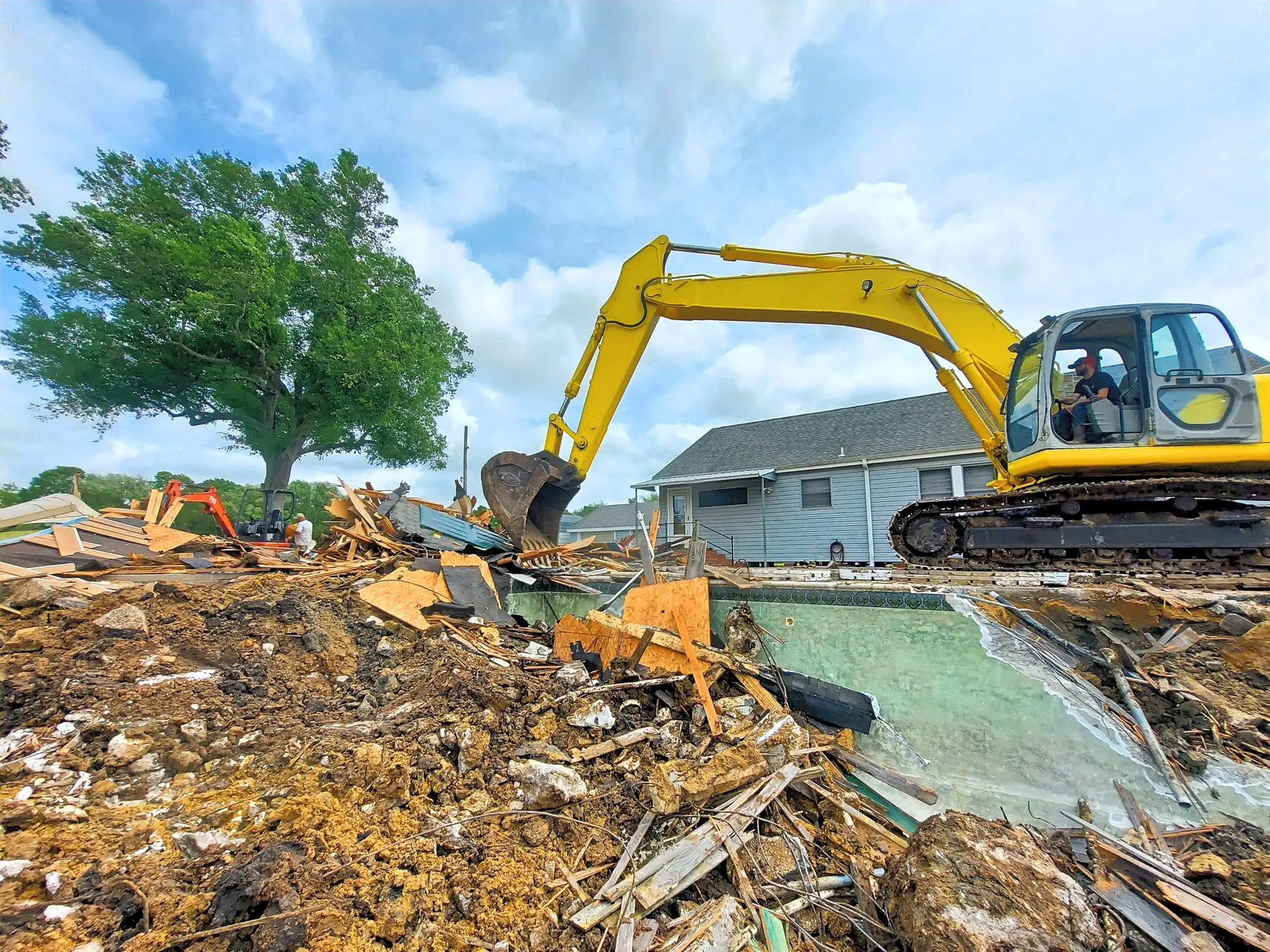 Swimming pool demolition and material removal by 409 Demo